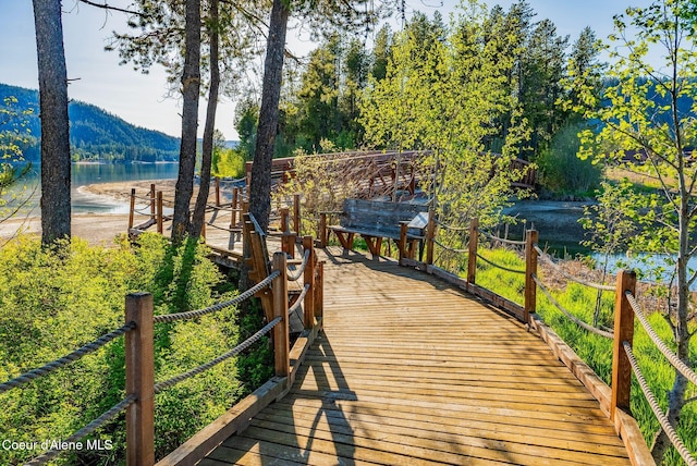 view of home's community featuring a water and mountain view