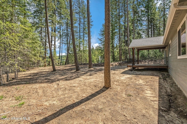 view of yard with a wooden deck