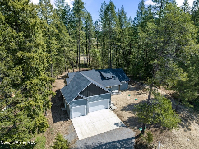 aerial view with a wooded view