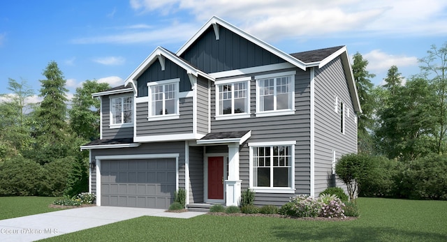 view of front of house with a front yard and a garage