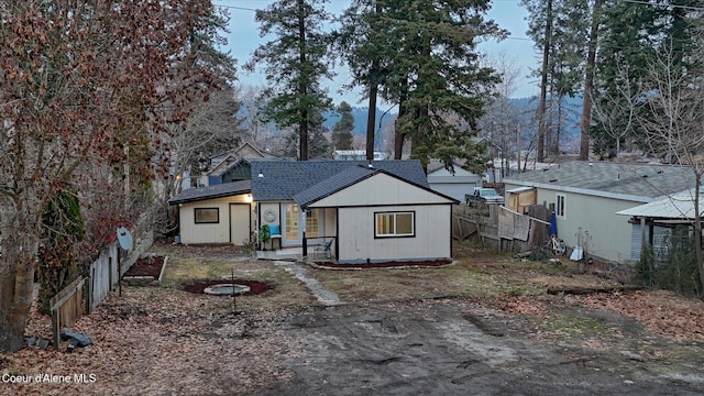 rear view of property with a mountain view