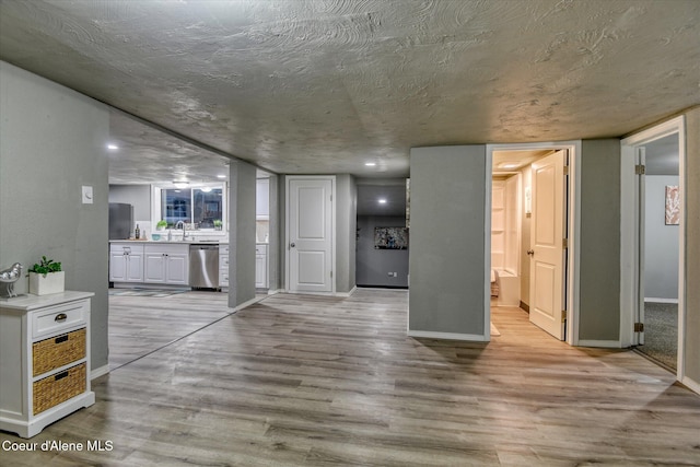 interior space with sink and light hardwood / wood-style flooring