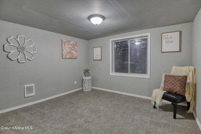 living area featuring carpet