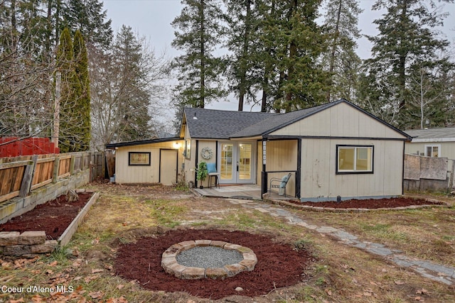 rear view of property featuring french doors