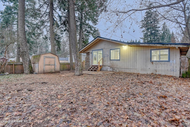 view of side of home with a storage unit