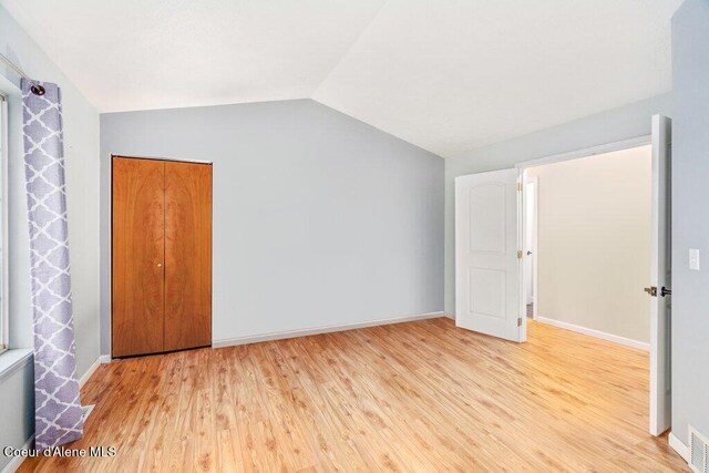 bonus room featuring light hardwood / wood-style floors and lofted ceiling