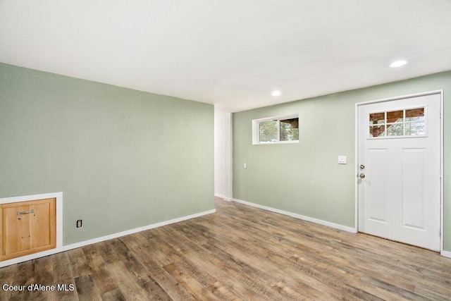 entryway with hardwood / wood-style flooring