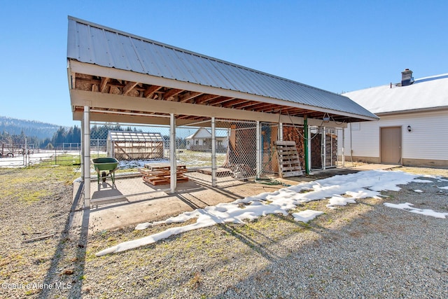 view of patio with an outbuilding