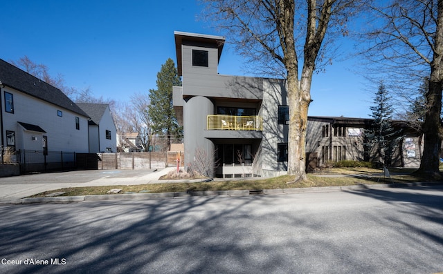 view of front of house with a balcony