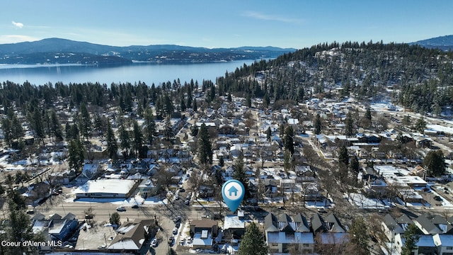 aerial view featuring a water and mountain view