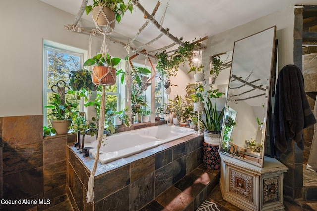 bathroom with tiled bath