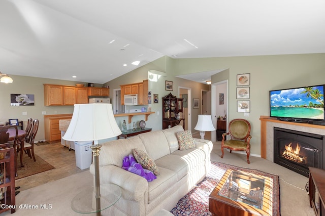 tiled living room with vaulted ceiling