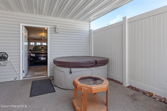 view of patio / terrace featuring a hot tub