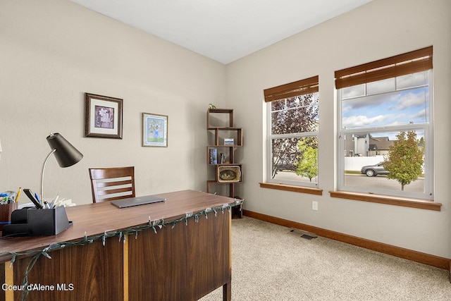 office area featuring light colored carpet