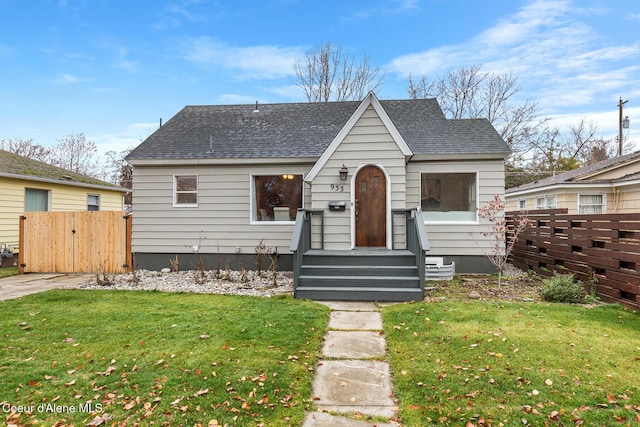 bungalow with a front lawn