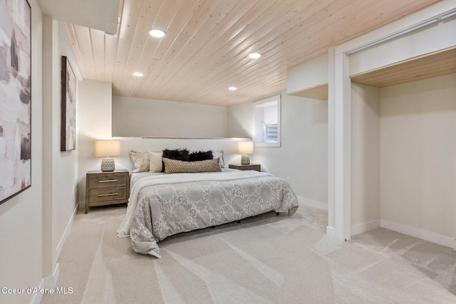 carpeted bedroom featuring wood ceiling