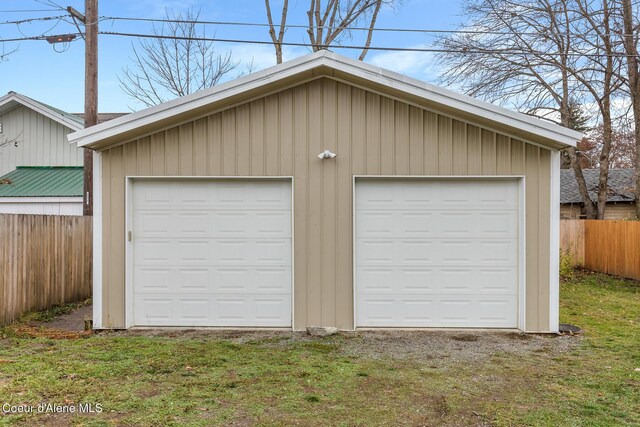 garage featuring a lawn