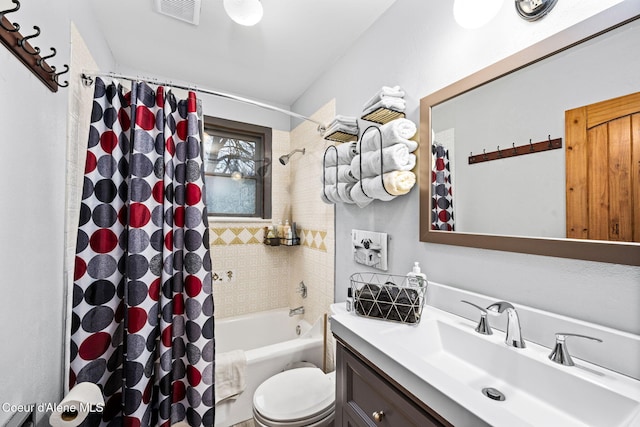 full bathroom featuring vanity, shower / bath combination with curtain, and toilet