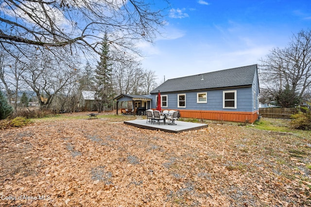 back of house with a patio