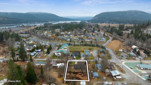 bird's eye view with a water and mountain view