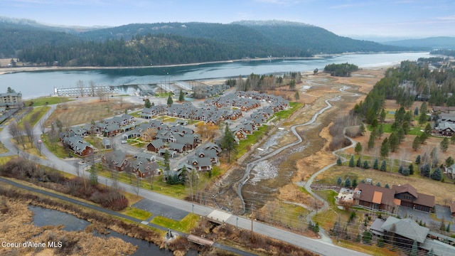 aerial view featuring a water and mountain view