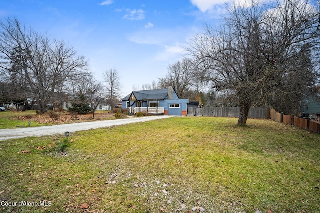 view of yard featuring covered porch