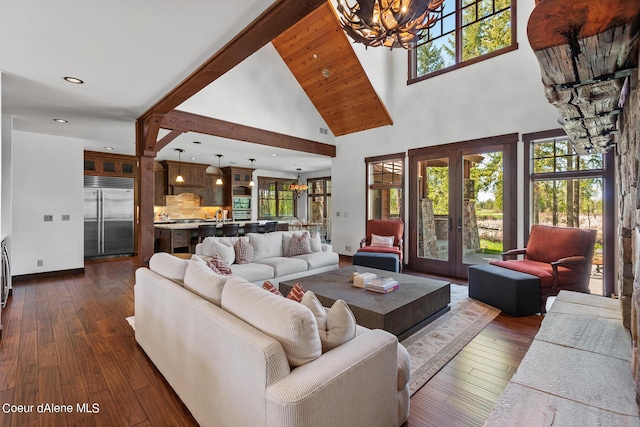 living room featuring a chandelier, french doors, high vaulted ceiling, and dark wood-type flooring