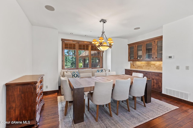 6126 S Gozzer Rd, Harrison, ID 83833 - dining room featuring a chandelier and dark hardwood / wood-style flooring