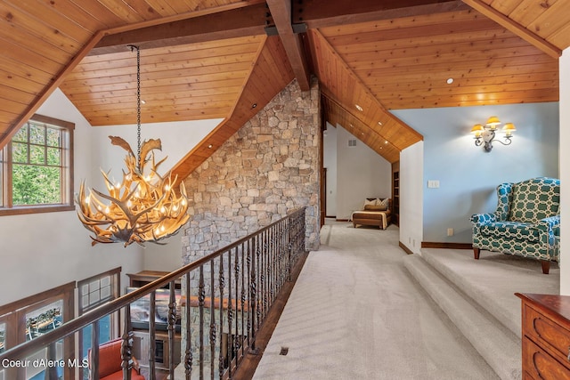 6126 S Gozzer Rd, Harrison, ID 83833 - hall featuring carpet, wooden ceiling, high vaulted ceiling, beam ceiling, and a chandelier