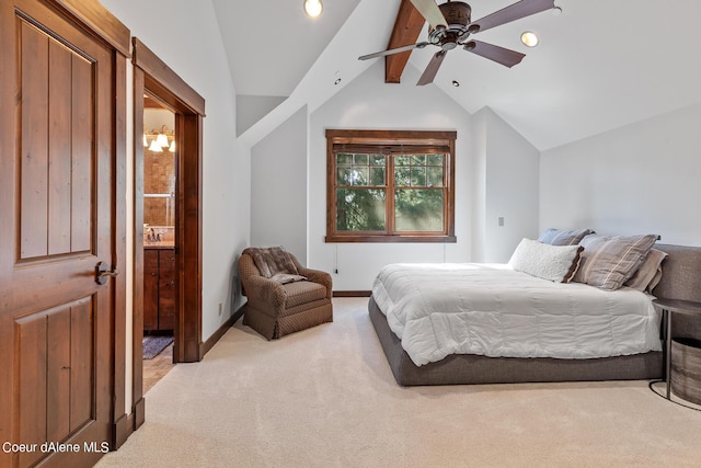 6126 S Gozzer Rd, Harrison, ID 83833 - carpeted bedroom with connected bathroom, ceiling fan, and vaulted ceiling with beams