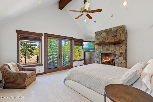 6126 S Gozzer Rd, Harrison, ID 83833 - carpeted bedroom featuring beamed ceiling, high vaulted ceiling, ceiling fan, and a stone fireplace