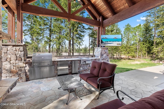 6126 S Gozzer Rd, Harrison, ID 83833 - view of patio with grilling area, outdoor lounge area, and exterior kitchen
