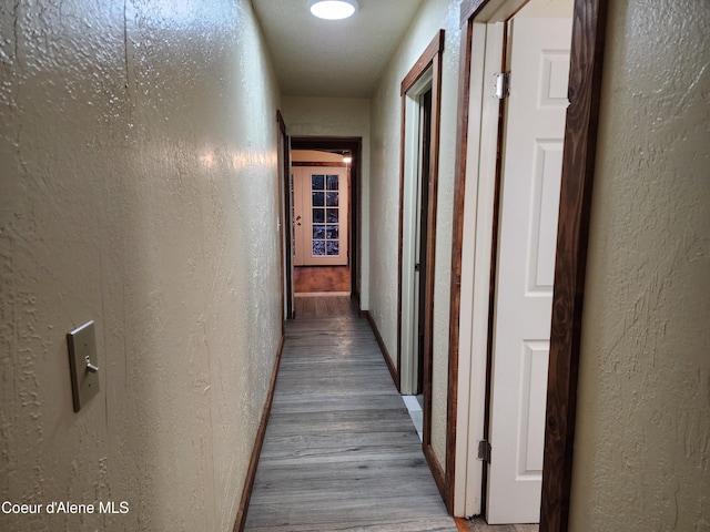 corridor featuring light hardwood / wood-style flooring