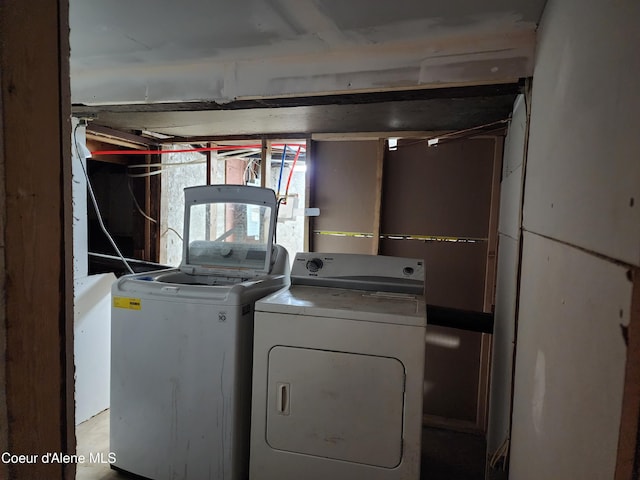 clothes washing area featuring separate washer and dryer