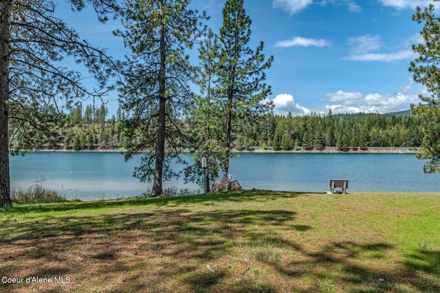 view of water feature with a view of trees