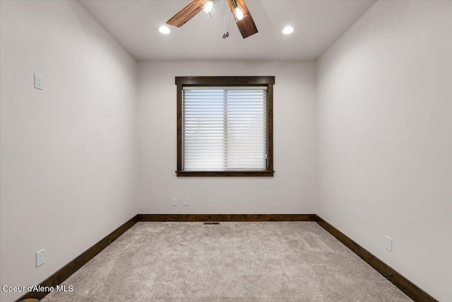 empty room with carpet floors and ceiling fan