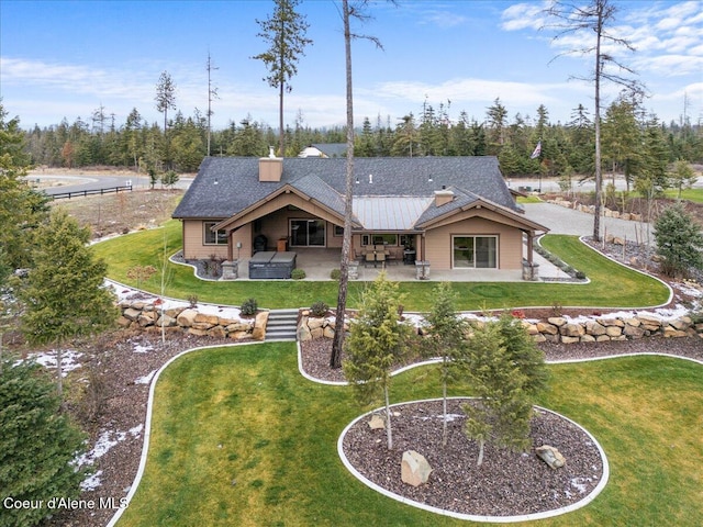 back of property with a patio