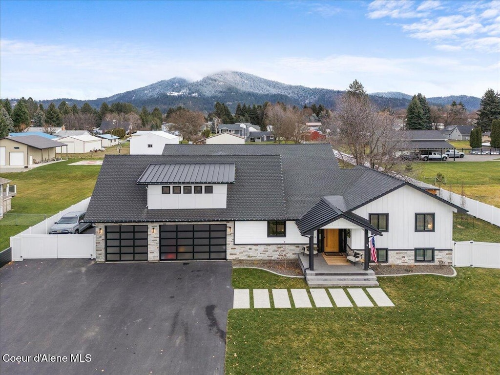 birds eye view of property with a mountain view