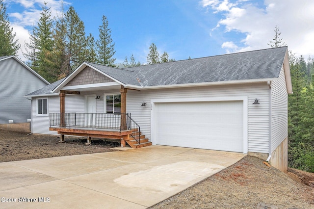 ranch-style home featuring a porch and a garage