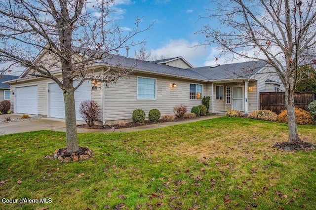 ranch-style home featuring a garage and a front yard