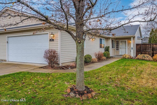 ranch-style home with a garage and a front yard