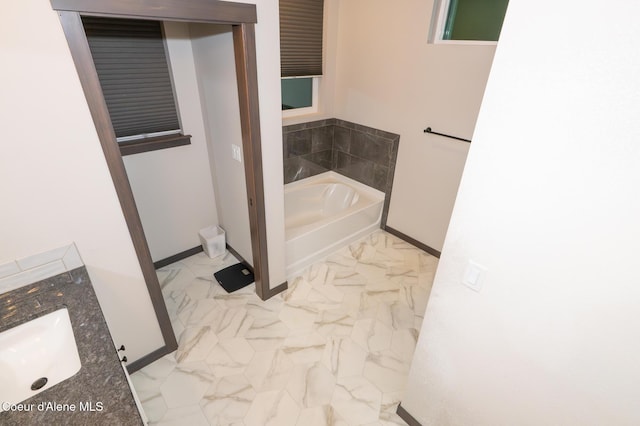 bathroom with a bathtub and vanity