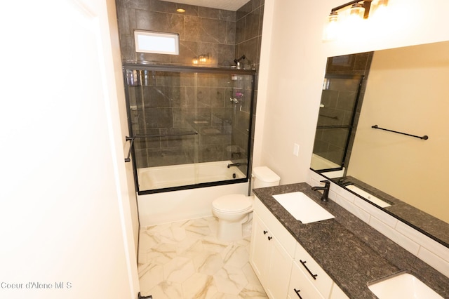 full bathroom featuring vanity, toilet, and bath / shower combo with glass door