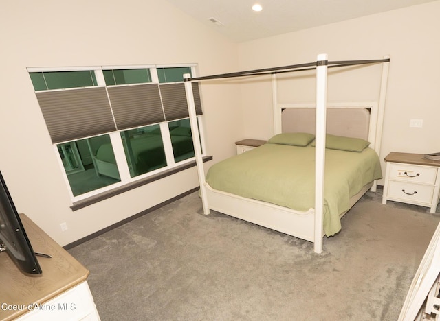 bedroom featuring carpet floors and lofted ceiling