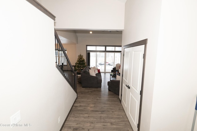 hallway with hardwood / wood-style floors