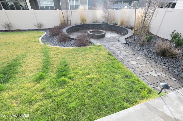 view of yard with a fire pit