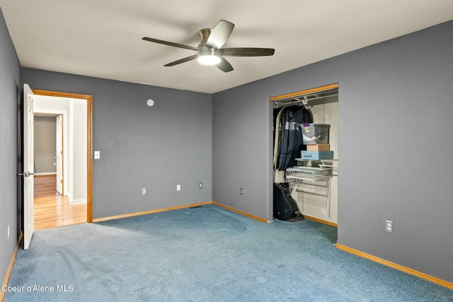 unfurnished bedroom with carpet flooring, ceiling fan, and a closet