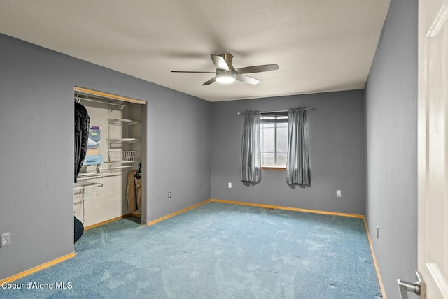 unfurnished bedroom with carpet, a closet, and ceiling fan