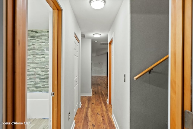 hallway with light wood-type flooring