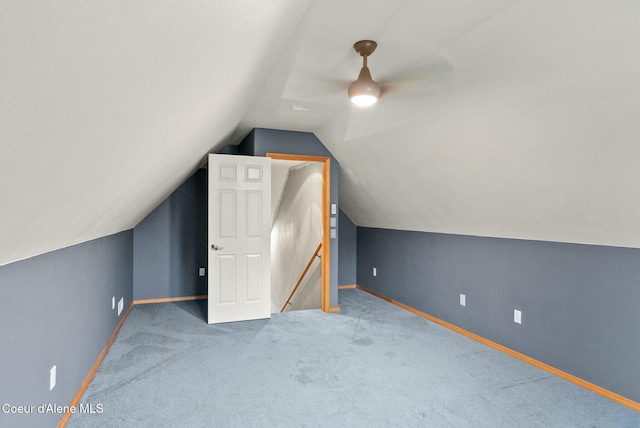 additional living space with carpet and lofted ceiling